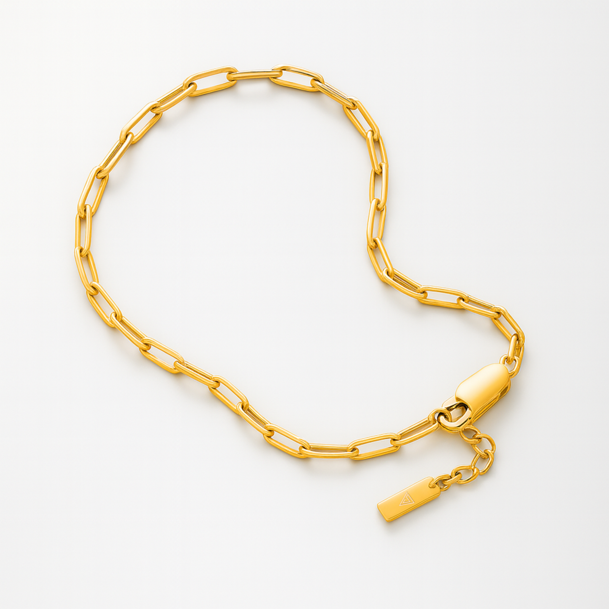 Gold chain necklace on a white background